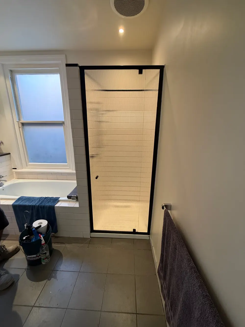 New reeded glass shower screen with matte black frame after replacement Melbourne