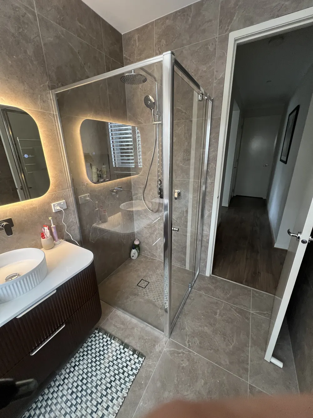 Completed frameless corner shower screen Melbourne