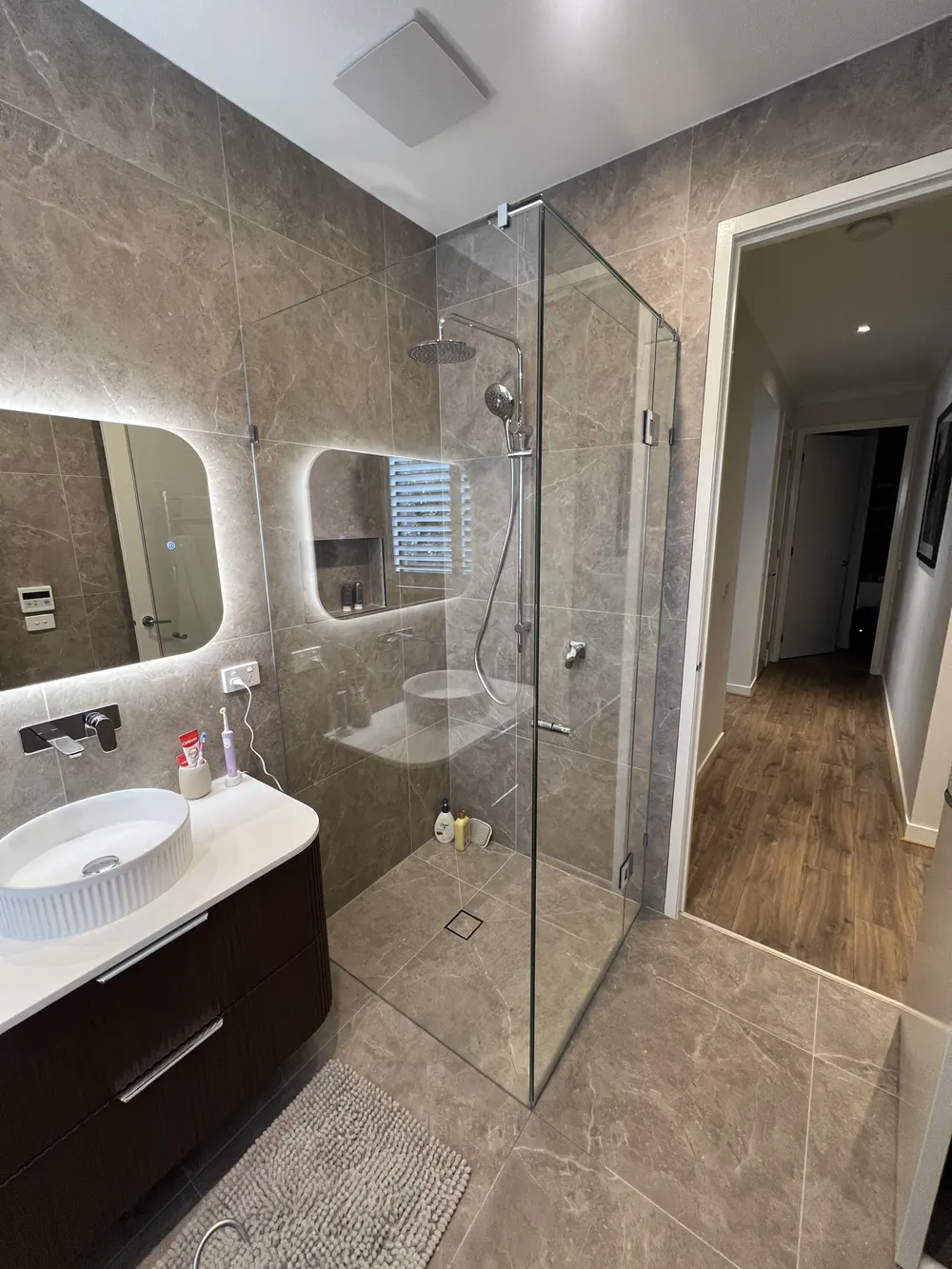 Completed frameless corner shower screen wide angle Melbourne
