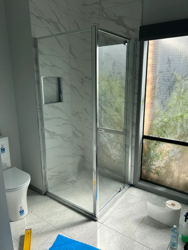 Semi-framed chrome pivot door shower screen